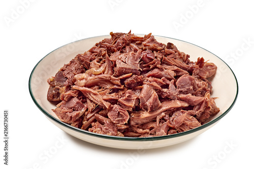 Plate of shredded beef barbacoa in shallow white bowl closeup, with beef, barbacoa, shredded, meat detail, showing bowl, plate, pulled, cooked context, with clear visible detail