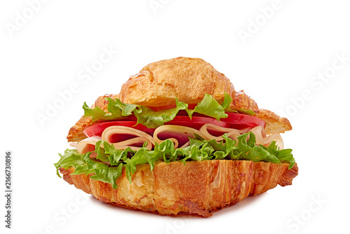 Crispy golden croissant sandwich filled with ham lettuce tomato and onion closeup frontal studio shot, with croissant, sandwich, ham, lettuce detail, showing tomato, onion, crispy, golden context