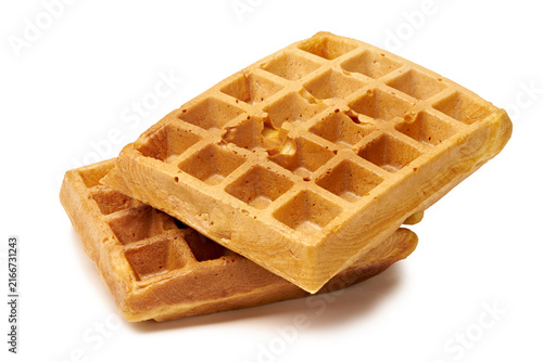 Golden Belgian waffles stacked on white background with crisp texture and grid pattern, with waffle, belgian, breakfast, stacked detail, showing crispy, toasted, golden, grid context