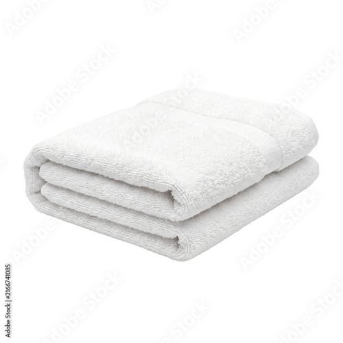 Foto Clean white folded bath towels stacked neatly on a white background