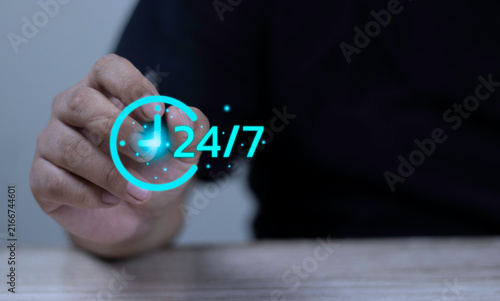 24/7 hotline support, non-stop customer assistance, and always available service concept with hand holding stylus pen pointing at glowing 24/7 clock icon.