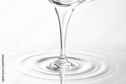 Transparent Liquid Flow With Circular Ripples on Clean White Background
