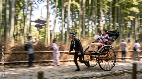Rickshaw Puller Transporting Tourists in Kyoto Bamboo Forest