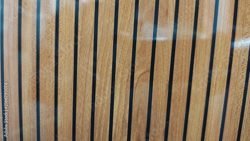 Quadro su tela Modern wood panel wall with black vertical inlay stripes for interior design