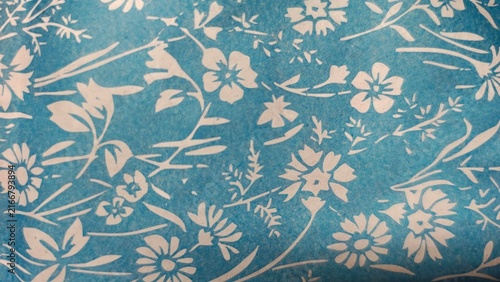 Fotografía Light blue floral paper texture background with white printed flower motif