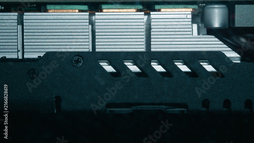 Fotografie Close-up of computer graphics card cooling system and metal casing