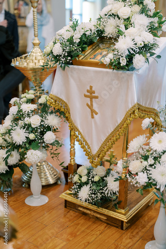 Fotografie Orthodox wedding ceremony altar with white floral decorations