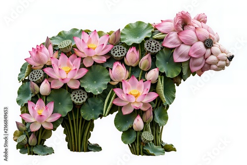 Creative bear silhouette made of pink lotus flowers and green lily pads on white background