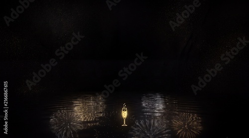 Single illuminated champagne glass reflects on a dark water surface with faint festive fireworks reflections.