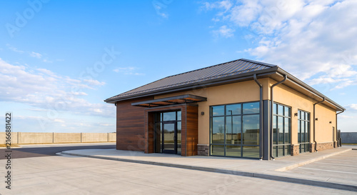 Modern Commercial Restaurant Building with Wood Siding and Metal Roof
