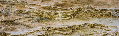 Obraz na plátně Raindrops causing bubbles in water colorful thermophiles in calcite scalloped lo