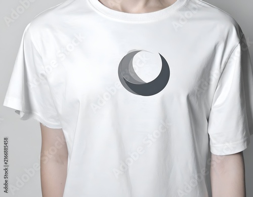 Person wearing white t-shirt with grey logo.