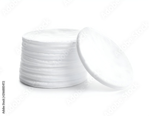 Pile of soft white cotton makeup removal pads.