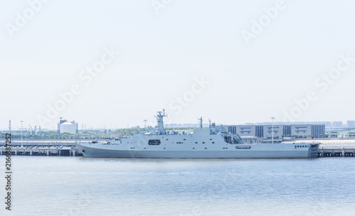 Photography Chinese naval vessel resting at a riverside berth near Shanghai, China, reflecting the country's growing maritime presence