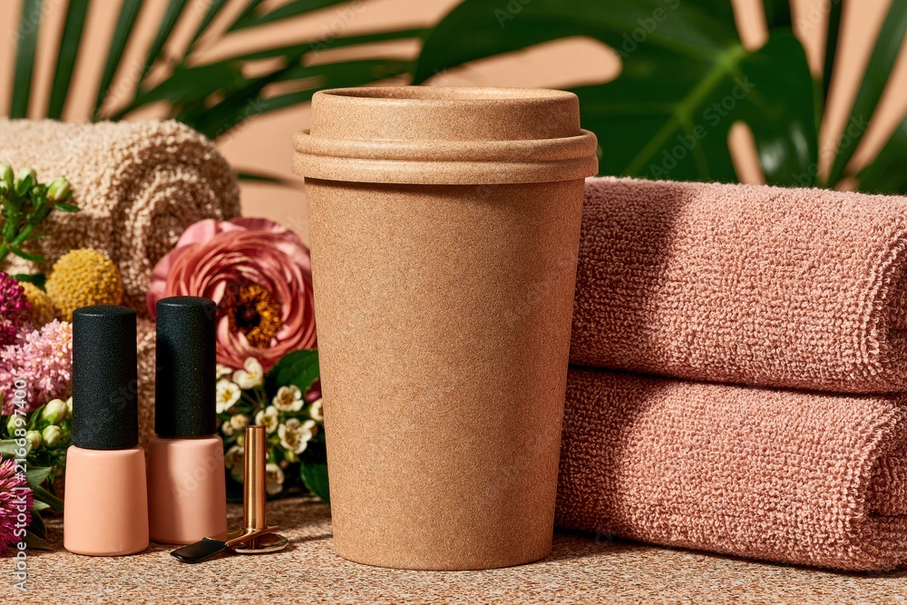 Fototapeta premium Eco friendly beauty spa setup with reusable cup towels and nail polish for wellness pampering