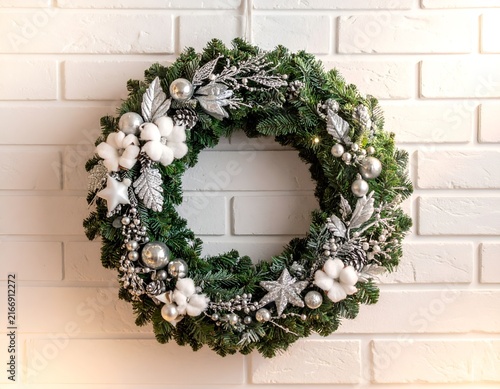 Winter wreath with cotton and silver ornaments.