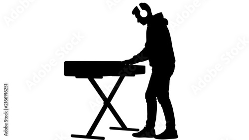 Silhouette of musician playing keyboard white background.