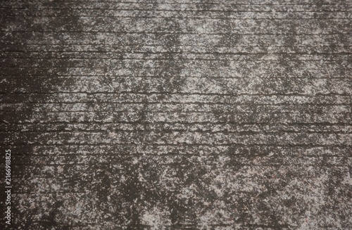 Canvas Print An outdoor concrete surface with rough, grooved edges and signs of age