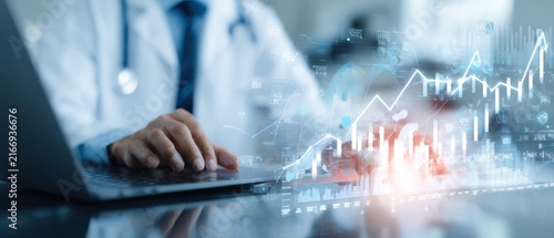 Medical professional analyzing financial data on a laptop