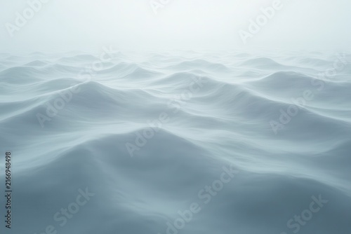Vast ocean surface with gentle waves under misty atmosphere, blending soft gradients of blue and white, creating ethereal depth and tranquil beauty of infinite horizon.