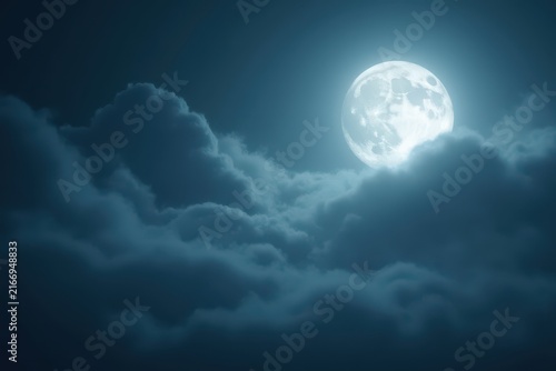 Bright full moon shines through soft dark clouds, casting a bluish glow across the night sky, with visible craters adding detail to this tranquil atmospheric scene.