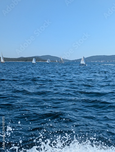 Obraz na plátne serene sailboats gliding across calm ocean waters on a peaceful journey