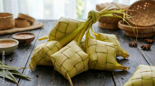 Traditional Indonesian Ketupat Rice Cakes on Rustic Table