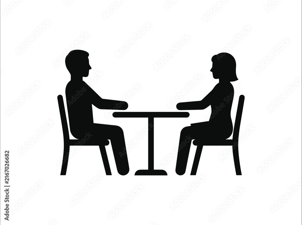 Fototapeta premium Silhouette of a man and woman sitting at a table