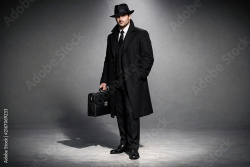 Mysterious Spy in Suit and Fedora