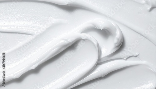 White cosmetic cream spreading on smooth surface