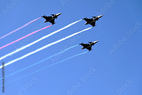 Budapest, Hungary - 08.20.2026: Airshow by the Parliament above the Danube river. Military fighting planes releasing colorful smoke streaks. red, white and green. celebration of the country foundation