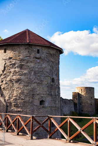 Canvastavla Ancient Stone Towers Stand Tall Within a Historic Fortress Under a Bright Blue S