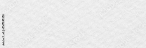White textured paper background with soft grain and copy space