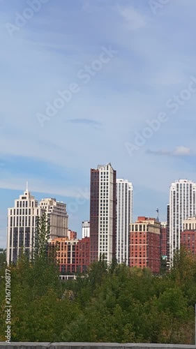 Modern City Skyline Under Blue Summer Sky