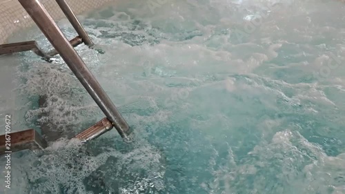 Water Flowing Through Pool Stairs and Handrails