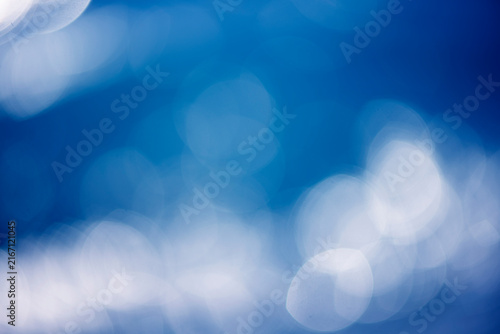 Abstract blue bokeh background, soft colored abstract background, blue blur texture with white motion lights