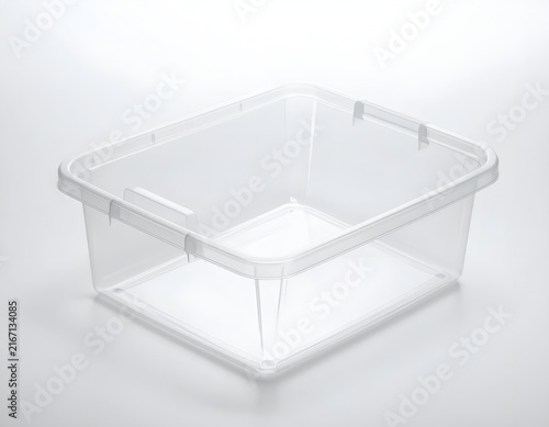 Transparent plastic storage tray for drawer organization.