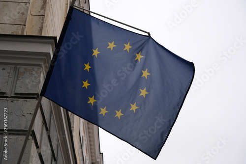 close-up European Union flag hanging on a building 