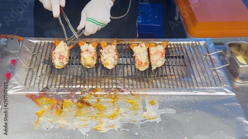 Korean Street Food – Grilling Whole Lobster in Shell on Hot Griddle at Outdoor Market Stall