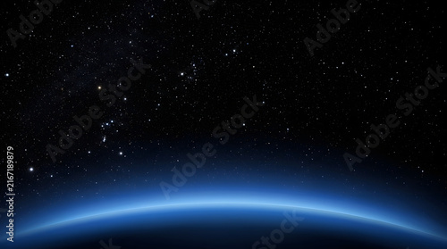 Edge of the World: A breathtaking view of Earth's curvature from space, illuminated by a vibrant blue glow against a backdrop of countless stars, evokes a sense of wonder and cosmic scale.
