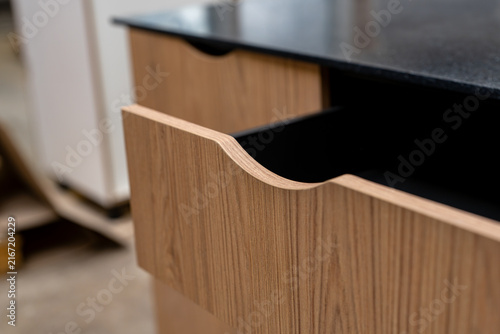 Bild auf Leinwand Bespoke oak cabinet with a black top
