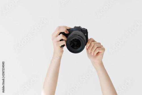 Bild auf Leinwand Woman hands holding professional photo camera isolated