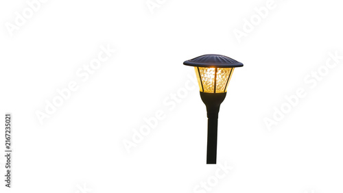 Lit solar garden lamp post isolated with outdoor solar powered on transparent background