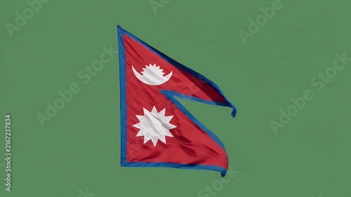 Nepal national flag waving in wind against green background for travel and culture themes