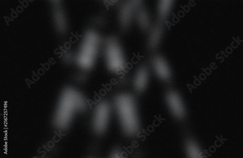 Fotografie Abstract blurred light shapes on dark background