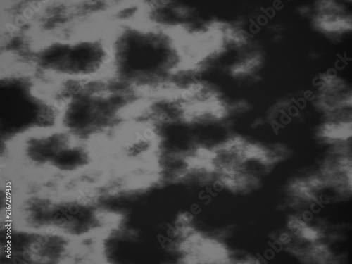 An abstract moody dark cloud background with smoky textures and soft monochromatic gradients creating a mysterious and atmospheric ethereal visual style.