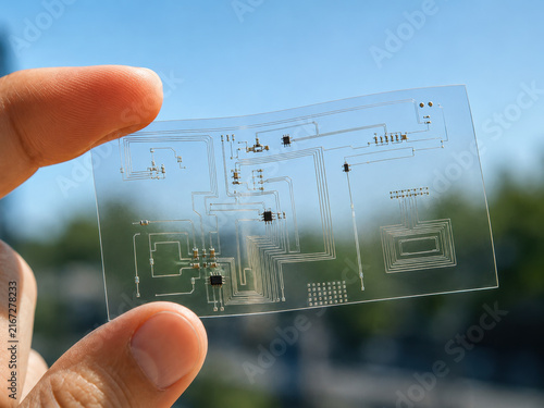 Microchip wafer in hand, transparent circuit board, technology concept