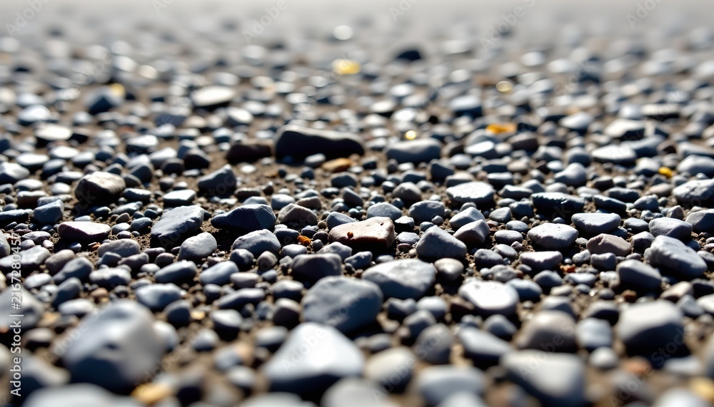 Obraz premium The image depicts a close up view of a rocky terrain, filled with numerous small to medium sized stones of various shapes and colors