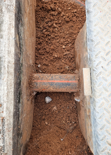 The perspective after dig the soil for HDPE pipe modification of control cable in switchyard.