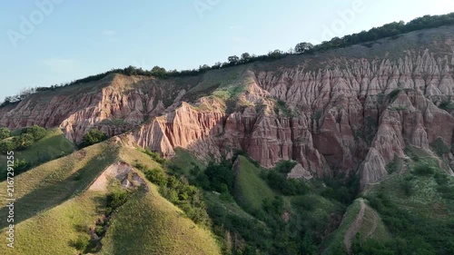 Sunrise Drone Flight Over Rapa Rosie Eroded Hills in Romania
